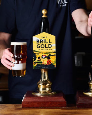 A pint of Brill Gold poured behind the bar in the Vale Tap Room